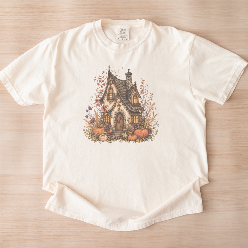 Stone Cottage Glowing Behind an Autumn Pumpkin Wreath Tee